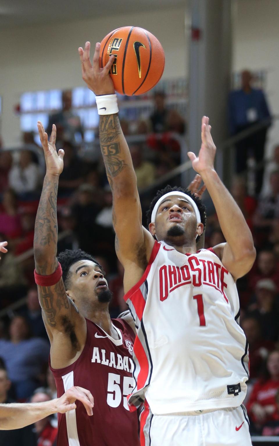 Ohio State's Roddy Gayle Jr. shoots while defended by Alabama's Aaron Estrada during the second half of an NCAA college basketball game Friday, Nov. 24, 2023, in Niceville, Fla. (AP Photo/Michael Snyder)
