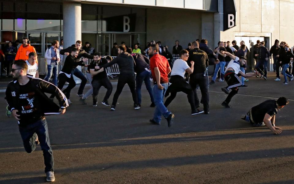 Disgraceful scenes in Lyon as shocking fan violence delays Europa League clash against Besiktas