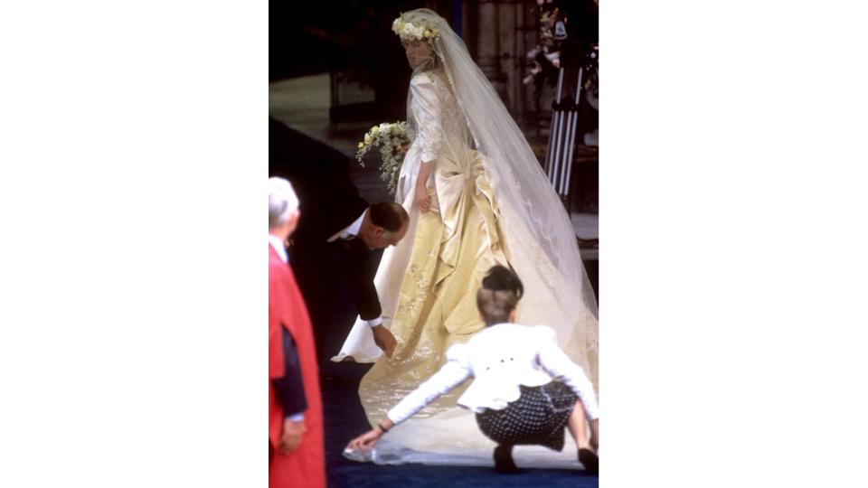 Sarah Ferguson getting help with her bridal train at Westminster Abbey