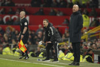 CORRECT ID TO MICHAEL SKUBALA , NOT SIMON HOOPER - Leeds United's interim head coach Michael Skubala, center, shouts out to his players during the English Premier League soccer match between Manchester United and Leeds United at Old Trafford in Manchester, England, Wednesday, Feb. 8, 2023. (AP Photo/Dave Thompson)