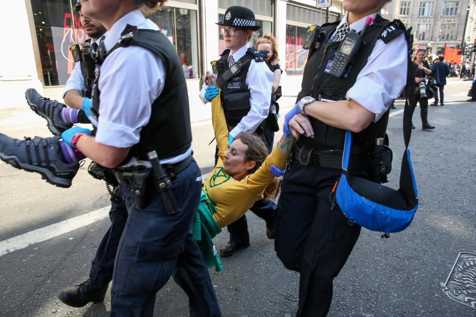 Protestors often lie down meaning it takes four officers to take them to custody. (PA)