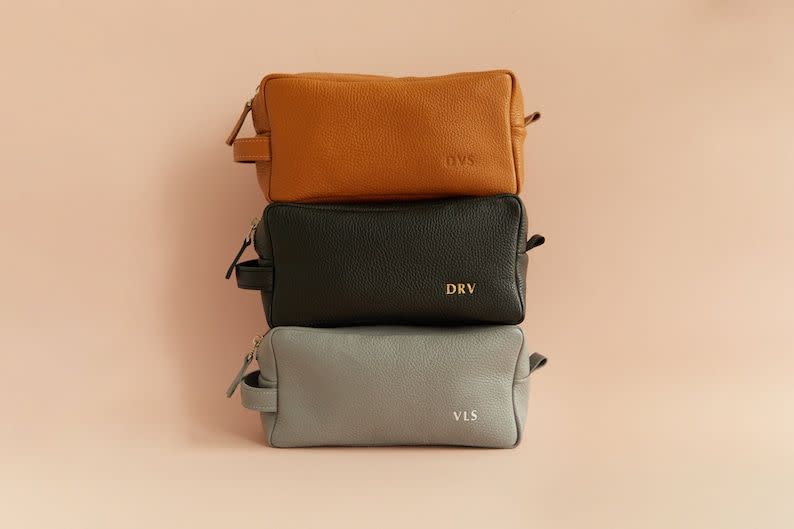 <p><strong>JungleGiftsStore</strong></p><p>etsy.com</p><p><strong>$22.87</strong></p><p>While these leather bags are trendy on their own, the bonus of adding personalized initials make them even better. One customer ordered two for her brothers as wedding presents, commenting on the "absolutely gorgeous finishing and quality of the product."</p>