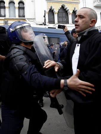 Police try to disperse lawyers marching during a protest to demand the immediate resignation of President Abdelaziz Bouteflika, in Algiers, Algeria March 23, 2019. REUTERS/Ramzi Boudina