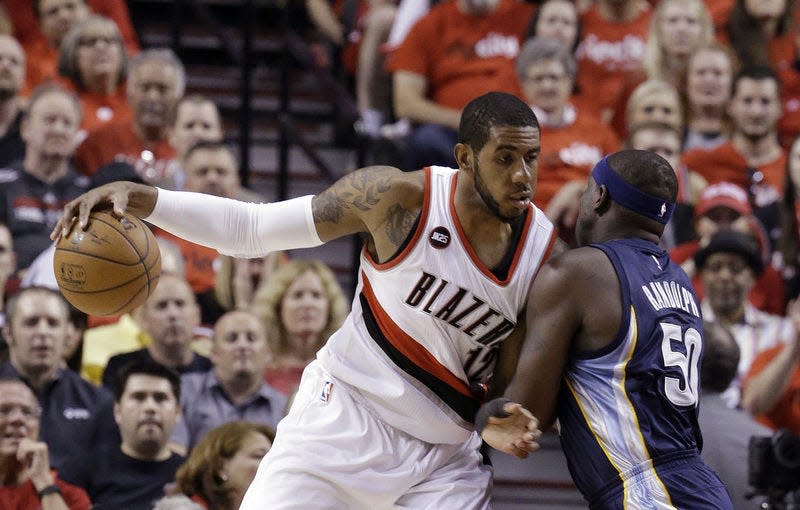 In this file photo, Portland Trail Blazers forward LaMarcus Aldridge, left, works the ball in against Memphis Grizzlies forward Zach Randolph. AP Photo/DON RYAN