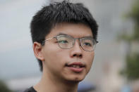 Pro-democracy activist Joshua Wong speaks to reporters after meeting with protesters near the Legislative Council in Hong Kong, Monday, June 17, 2019. Wong, a leading figure in Hong Kong's 2014 Umbrella Movement demonstrations, was released from prison on Monday and vowed to soon join the latest round of protests. (AP Photo/Kin Cheung)