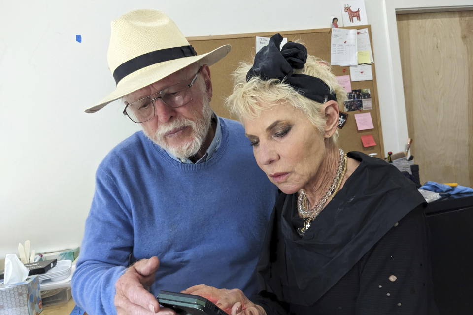 Richard Schoellhorn, left, discusses his experience as a would-be security guard at the Woodstock festival in August 1969 with Rona Elliot, right, May 9, 2023, in San Francisco. Elliot helped Woodstock organizers put the haphazard event together and is now working as a “community connector” as part of the Museum at Bethel Woods’ effort to collect oral histories from people who were there. (AP Photo/Michael Liedtke)