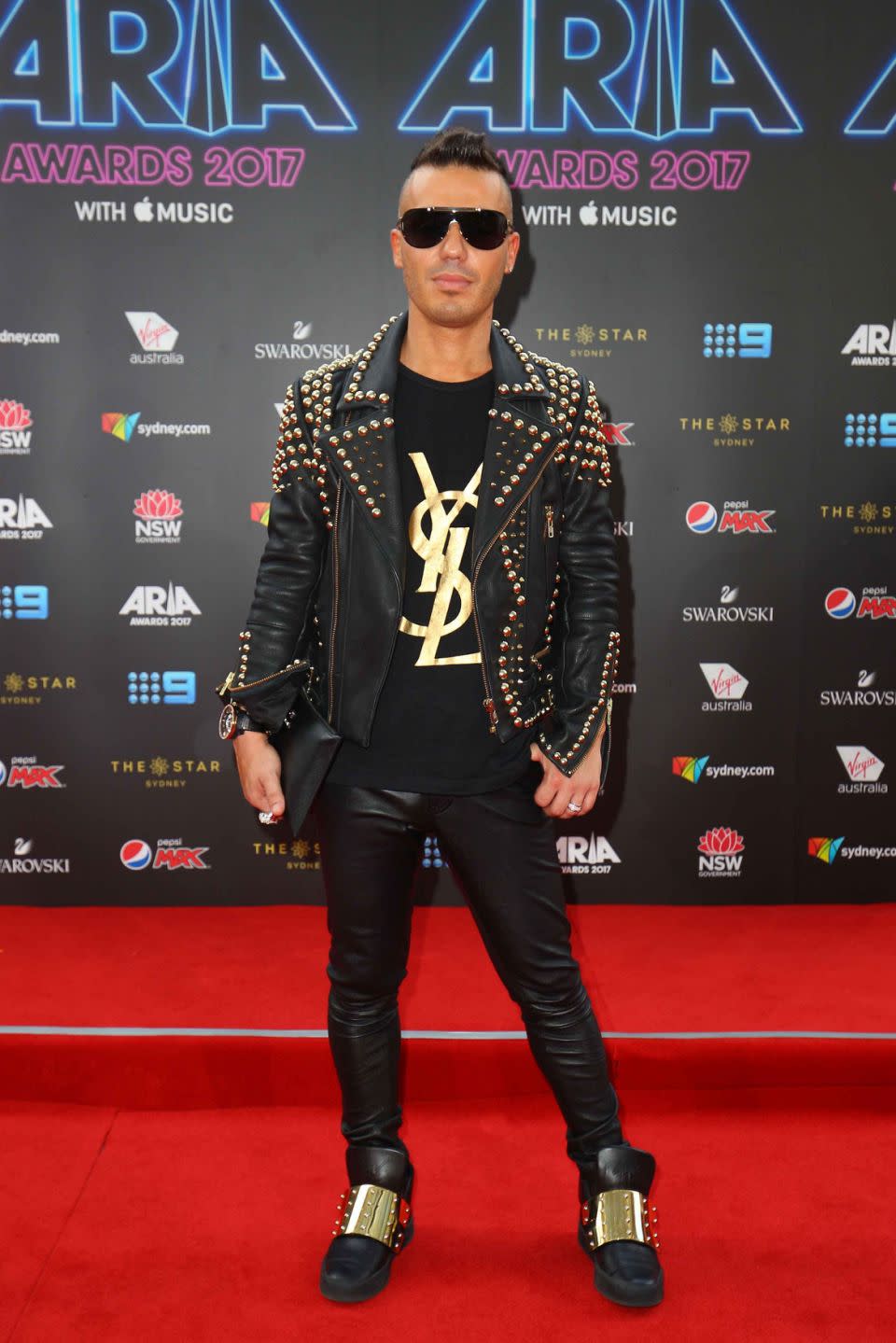 The singer looked chic in all black with accents of gold throughout his outfit. Source: Getty