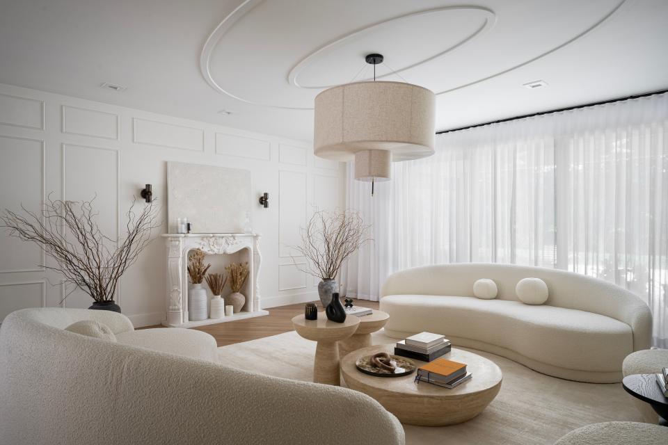 In this Aventura residence, Bea Interiors Design added texture to the light-colored palette using bouclé furniture.