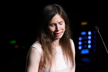 Amanda Knox, who has returned to Italy for the first time since being cleared of the murder of British student Meredith Kercher, cries as she speaks at the Criminal Justice Festival in Modena