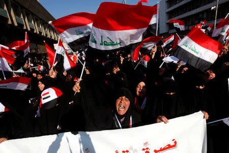 FILE PHOTO: Supporters of Iraqi Shi'ite cleric Moqtada al-Sadr shout slogans during a protest demanding an overhaul of the elections' supervision commission ahead of provincial elections due in September in Baghdad, Iraq, February 11, 2017. REUTERS/Alaa Al-Marjani/File Photo