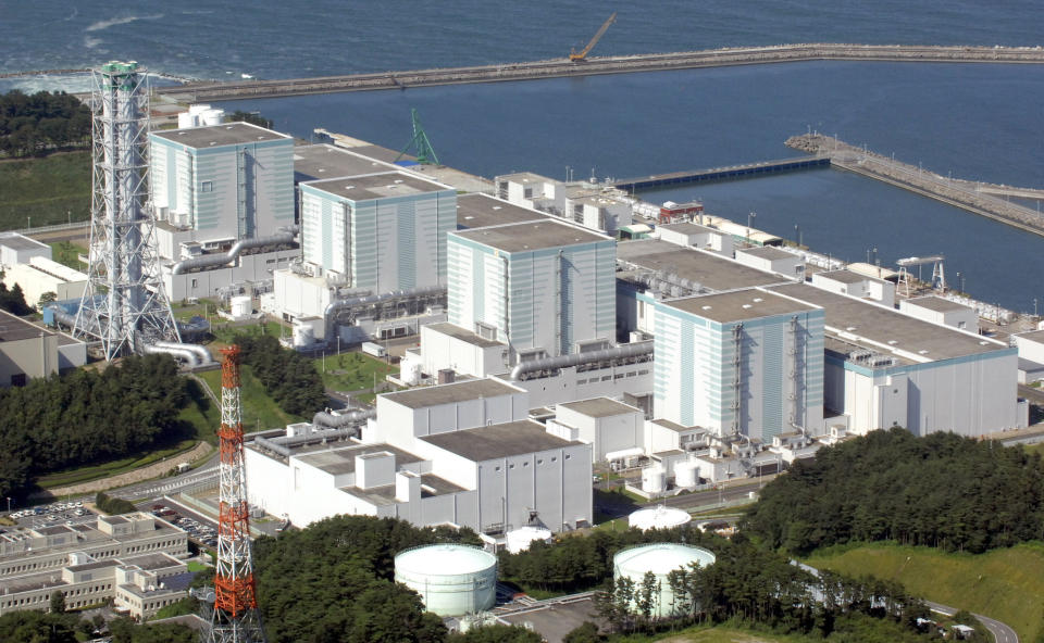 FILE - In this Aug. 10, 2006, file photo, the Fukushima Daini Nuclear Power Plant in Tomiokamachi, Fukushima Prefecture, is seen. Japan's nuclear policy-setting body has adopted a report saying the country is entering an era of massive nuclear plant decommissioning, urging operators to plan ahead to lower safety risks and costs on work requiring decades and billions of dollars. (Kyodo News via AP, File)