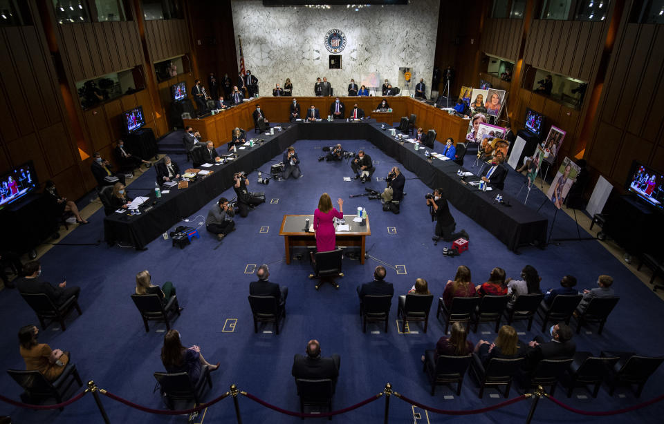 Supreme Court nominee Amy Coney Barrett is sworn in during a confirmation hearing before the Senate Judiciary Committee, Monday, Oct. 12, 2020, on Capitol Hill in Washington. (Kevin Dietsch/Pool via AP)