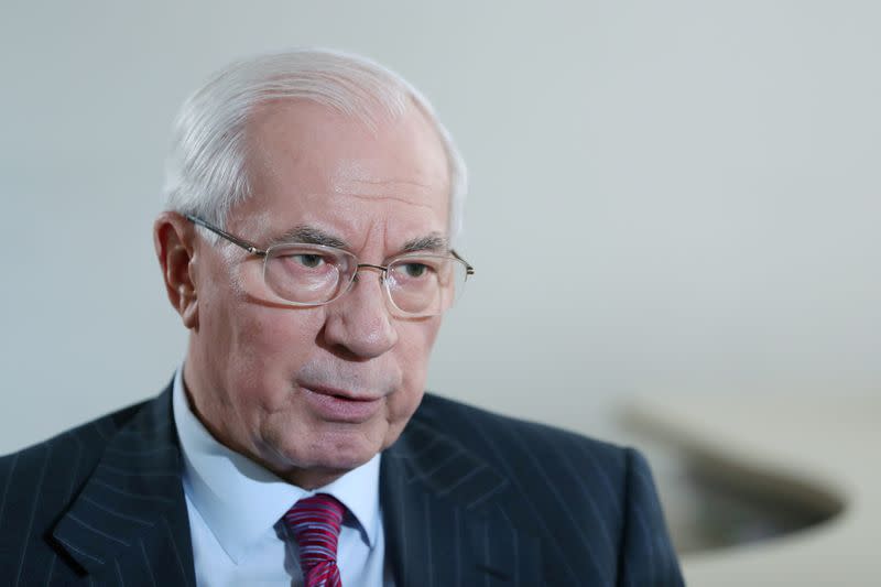 FILE PHOTO: Former Ukrainian Prime Minister Mykola Azarov speaks during an interview with Reuters in Moscow