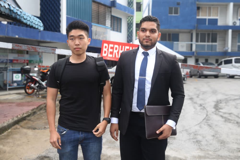 UM graduate Wong Yan Ke (left) and his legal representative Asheeq Ali  are pictured outside the Petaling police station in Kuala Lumpur October 16, 2019.— Picture by Choo Choy May