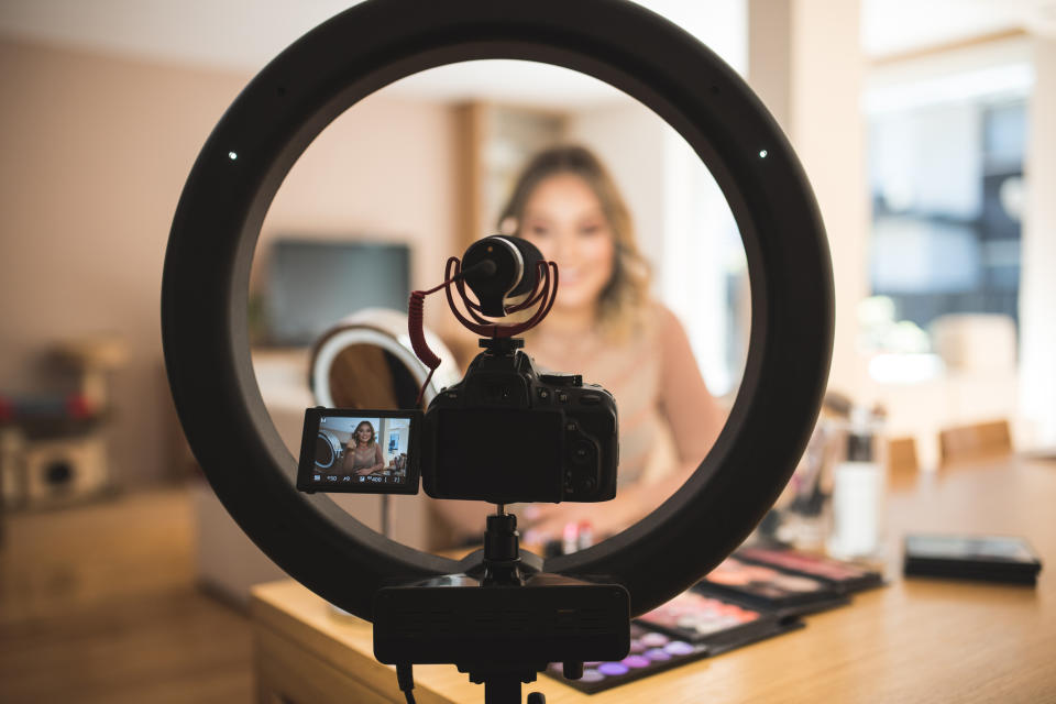 A woman filming a video of herself