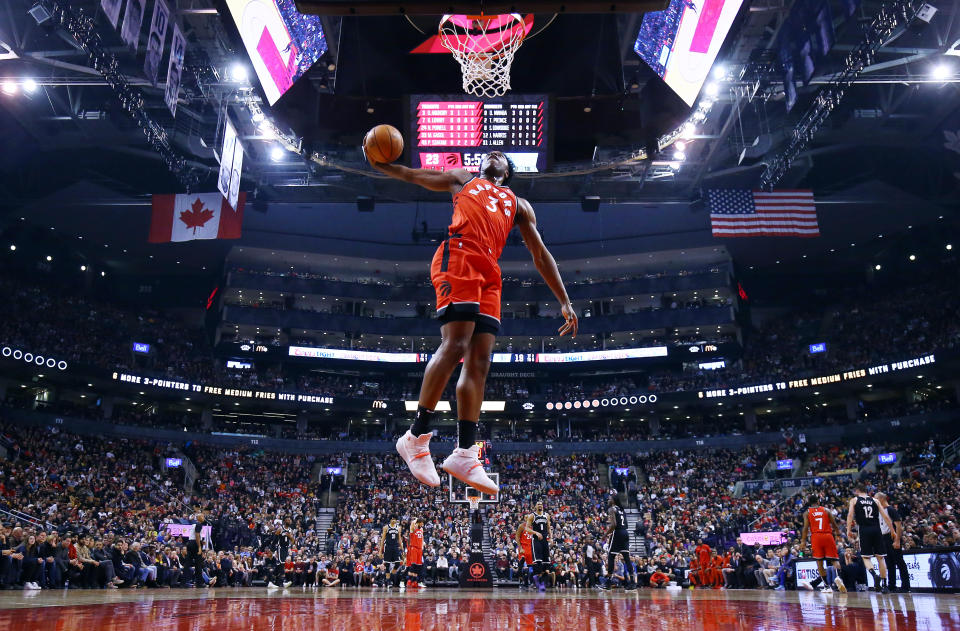 OG Anunoby #3 of the Toronto Raptors attempts a dunk after a stoppage in play.