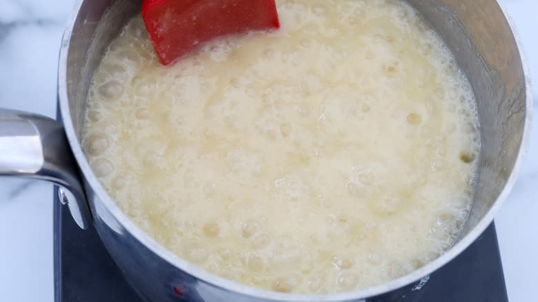 white fudge cooking in pot