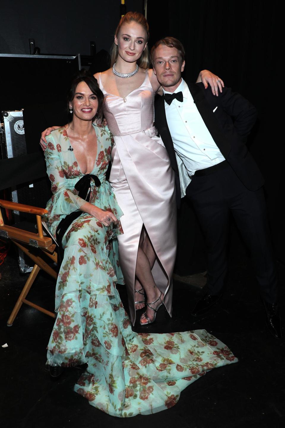 Lena Headey (Cersei Lannister), Turner, and Alfie Allen (Theon Greyjoy) backstage.