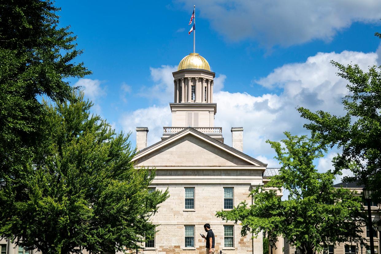 The recently gilded dome of the Old Capitol Building is seen as University of Iowa students walk to class on the first day of the fall semester, Monday, Aug. 22, 2022, in Iowa City, Iowa.