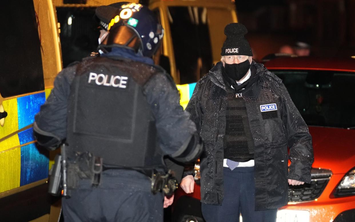 Prime Minister Boris Johnson observes an early morning Merseyside Police raid on a home in Liverpool as part of an operation to tackle County Lines drug dealings - Christopher Furlong/Getty Images Europe