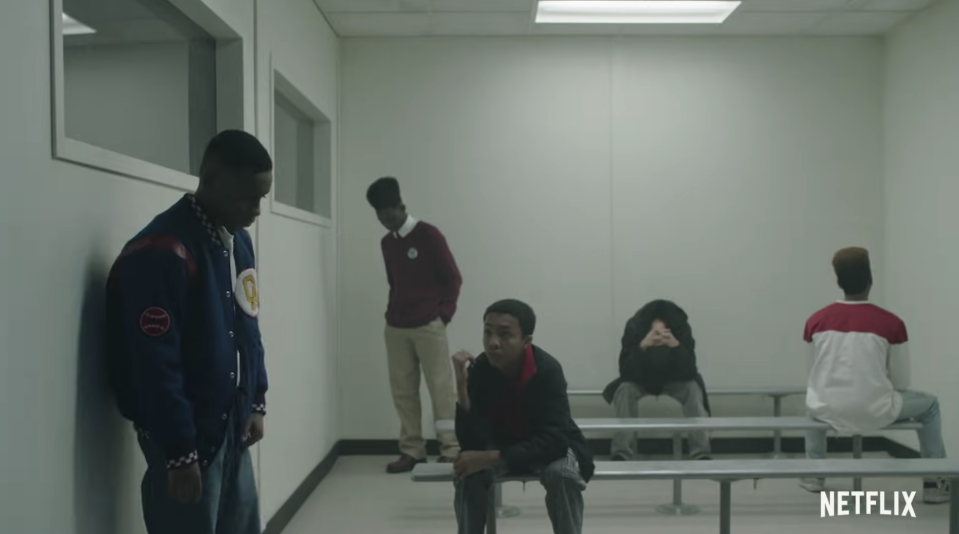 A screenshot from When They See Us shows five Black boys in a holding cell