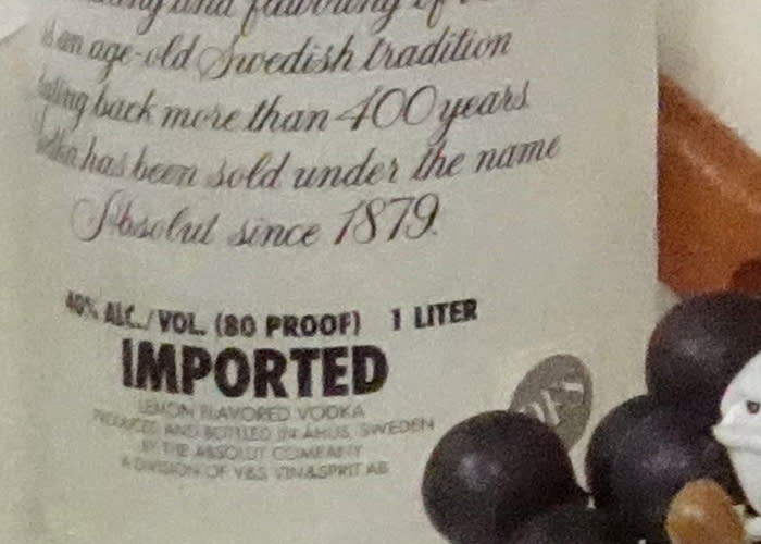 100% zoom into said text at ISO 12,800. Five-figure ISO setting on a 1-inch sensor, and you can still tell it's lemon flavored vodka bottled in Sweden. Pretty neat.