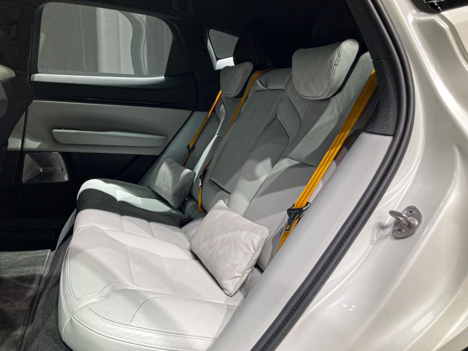 The white back seats of the Polestar 3 electric SUV, viewed from outside the vehicle.