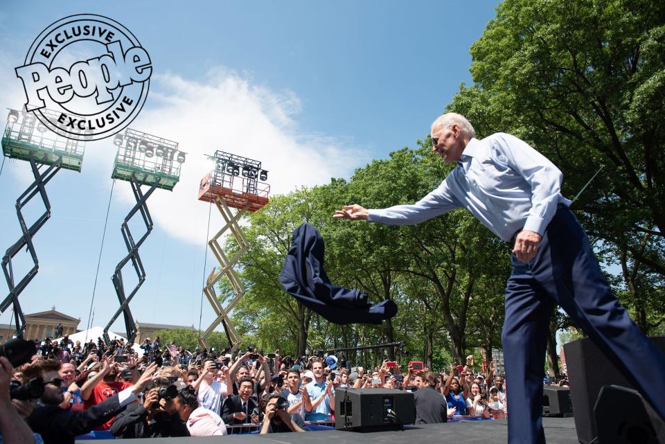Biden tosses his suit jacket to the crowd just after being introduced by his wife at the official launch of his campaign in Philadelphia on May 18, 2019.