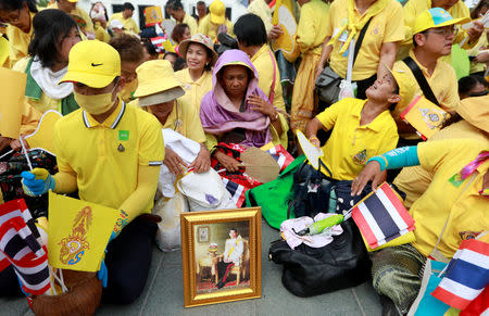 People wait outside the balcony of Suddhaisavarya Prasad Hall at the Grand Palace, where King Maha Vajiralongkorn will grant a public audience to receive the good wishes of the people in Bangkok, Thailand May 6, 2019. REUTERS/Soe Zeya Tun