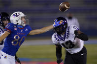 Kansas wide receiver Luke Grimm (80) reaches for the ball while covered by TCU linebacker Dee Winters (13) during the first half of an NCAA college football game in Lawrence, Kan., Saturday, Nov. 28, 2020. The pass was incomplete. (AP Photo/Orlin Wagner)