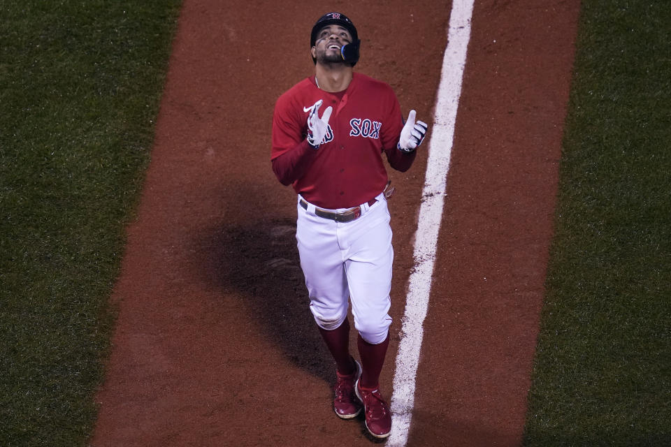 Boston Red Sox's Xander Bogaerts celebrates as heads for home after his grand slam during the fifth inning of the team's baseball game against the Tampa Bay Rays, Tuesday, Oct. 4, 2022, at Fenway Park, in Boston. (AP Photo/Charles Krupa)