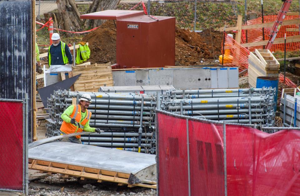 A construction crew works on building the Ferguson International Center on the Indiana University campus on Thursday, Dec. 2, 2021.