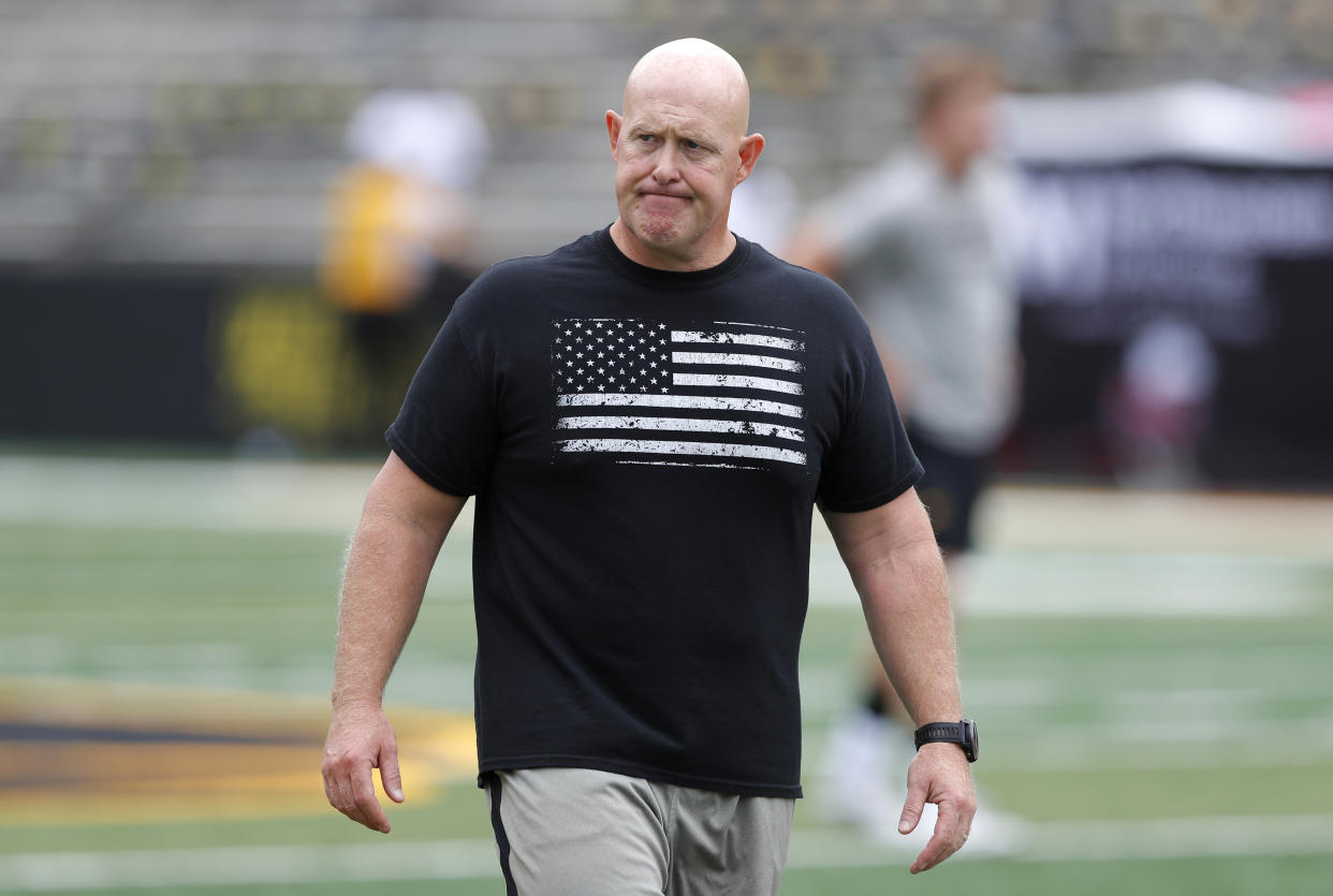 Iowa strength and conditioning coach Chris Doyle walks on the field before an NCAA college football game between Iowa and Northern Illinois, Saturday, Sept. 1, 2018, in Iowa City, Iowa. (AP Photo/Charlie Neibergall)