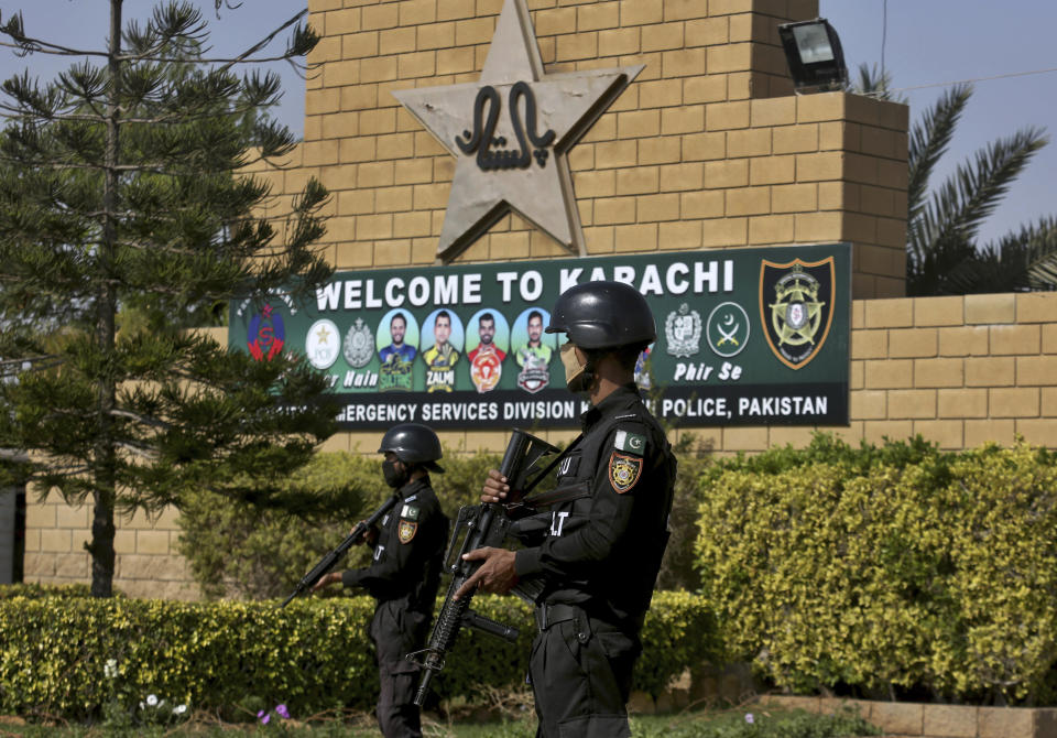 Pakistan police commandos stand guard outside the National Stadium, where the Pakistan Cricket Team is practicing for the upcoming test match against South Africa, in Karachi, Pakistan, Thursday, Jan. 21, 2021. Pakistan will play the first test match on Jan. 26, against South Africa's cricket team, who arrived in Karachi last Saturday for the first time in nearly 14 years. (AP Photo/Fareed Khan)