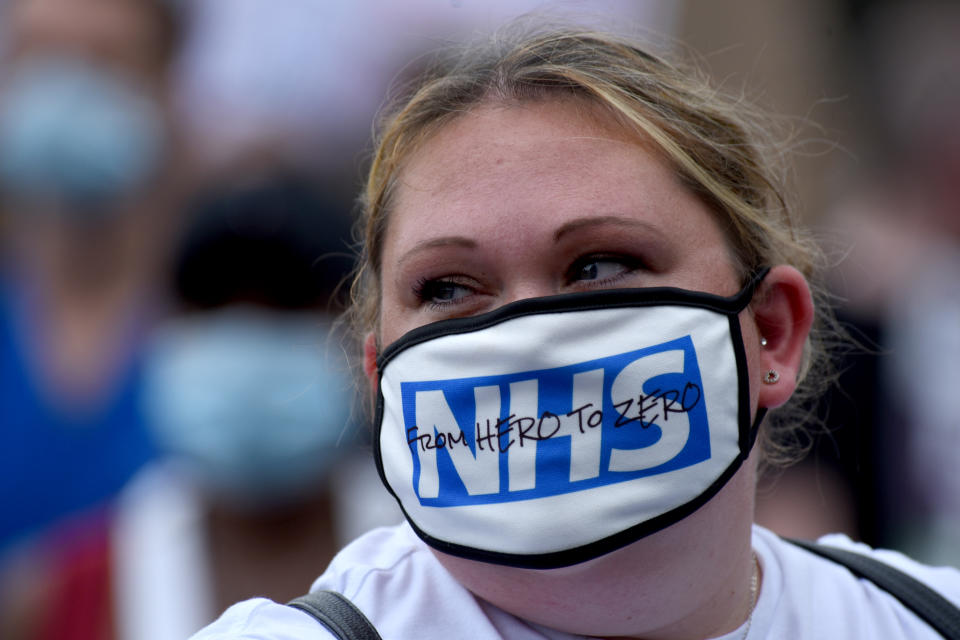 LONDON, UNITED KINGDOM - AUGUST 08: Nurses and other frontline NHS workers stage a protest at No 10 Downing Street after being left out of a public sector pay rise on August 08, 2020 in London, United Kingdom. NHS staff across the UK are demanding an early salary increase after they were not included in the governmentâs above-inflation coronavirus pay rise for public sector workers because of a three-year pay deal negotiated in 2018. (Photo by Kate Green/Anadolu Agency via Getty Images)