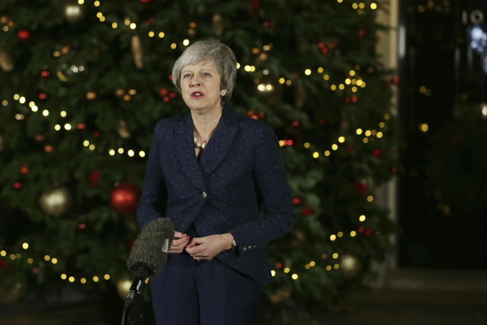 British Prime Minister Theresa May walks from 10 Downing Street to make a statement, in London, Wednesday December 12, 2018. British Prime Minister Theresa May survived a brush with political mortality Wednesday, winning a no-confidence vote of her Conservative lawmakers that would have ended her leadership of party and country (AP Photo/Tim Ireland)