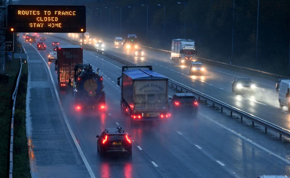 A sign on the M56 motorway informs drivers that all routes into France are closed at the junction with the M6 at Lower Stretton near Warrington, northwest England, on December 21, 2020. - The British prime minister was to chair a crisis meeting on December 21 as a growing number of countries blocked flights from Britain over a new highly infectious coronavirus strain the UK said was "out of control". Crucial transit country France moved to block people and goods crossing the Channel, while the Netherlands said passengers arriving by ferry would be denied entry. (Photo by Paul ELLIS / AFP) (Photo by PAUL ELLIS/AFP via Getty Images)