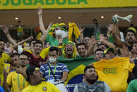 Fans celebrate their team's win over Uruguay at the end of a qualifying soccer match for the FIFA World Cup Qatar 2022 at Arena da Amazonia in Manaus, Brazil, Thursday, Oct.14, 2021. Brazil won 4-1. (AP Photo/Andre Penner)