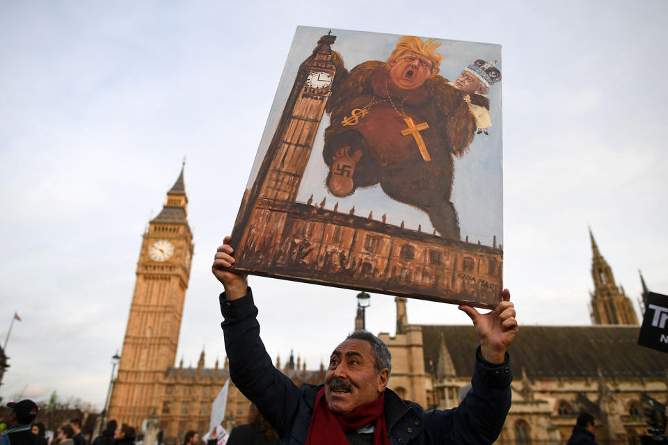 <p>Satirical artist Kaya Mar holds a placard during a protest against U.S. President Donald Trump in London, Feb. 20, 2017. (Photo: Justin Tallis/AFP/Getty Images) </p>