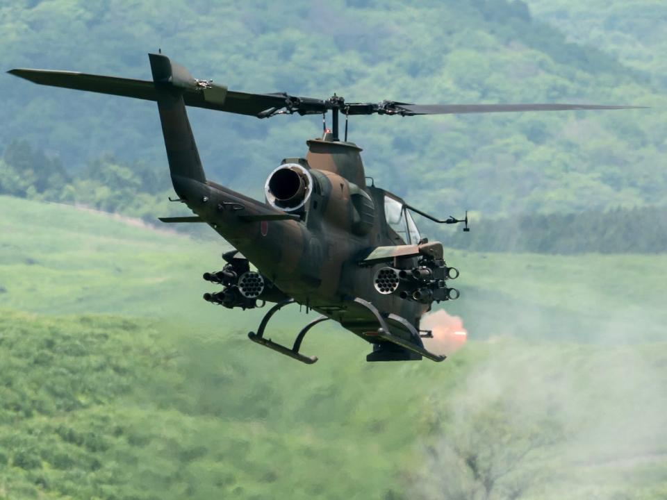 A rear-view of a Japan Ground Self-Defense Force AH-1S Cobra attack helicopter in a live-fire exercise