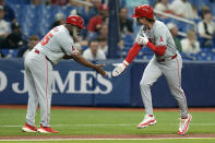 Los Angeles Angels' Mickey Moniak, right, celebrates his two-run home run off Tampa Bay Rays starting pitcher Aaron Civale with third base coach Eric Young Sr. during the fourth inning of a baseball game Tuesday, April 16, 2024, in St. Petersburg, Fla. (AP Photo/Chris O'Meara)