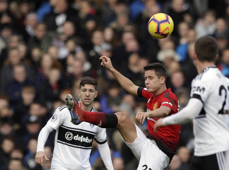 Manchester United's Ander Herrera, center, duels for the ball with Fulham's Luciano Vietto, left, and Joe Bryan during the English Premier League soccer match between Fulham and Manchester United at Craven Cottage stadium in London, Saturday, Feb. 9, 2019. (AP Photo/Matt Dunham)