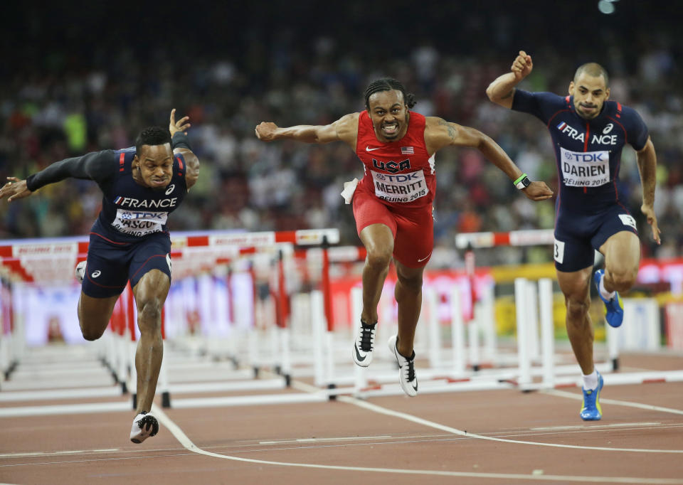 FILE - United States' Aries Merritt, center, France's Dimitri Bascou, left, and France's Garfield Darien compete in the men's 110m hurdles final at the World Athletics Championships at the Bird's Nest stadium in Beijing, Aug. 18, 2015. Top hurdlers reach out to world-record holder Aries Merritt to ask for his input all the time. So do those going through transplants. Merritt had a kidney transplant in 2015, just days after winning a bronze medal at the Beijing world championships. (AP Photo/David J. Phillip, File)