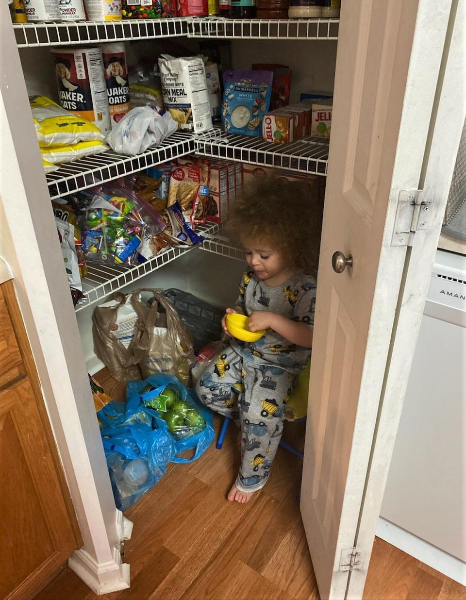 Jeffery Anderson sneaks a snack in the family's pantry.