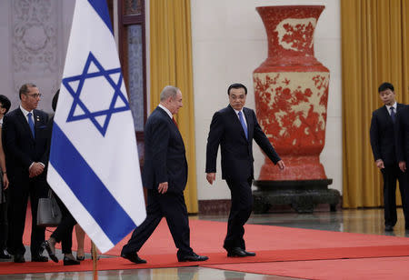 Israeli Prime Minister Benjamin Netanyahu and China's Premier Li Keqiang attend a welcoming ceremony at the Great Hall of the People in Beijing, China March 20, 2017. REUTERS/Jason Lee