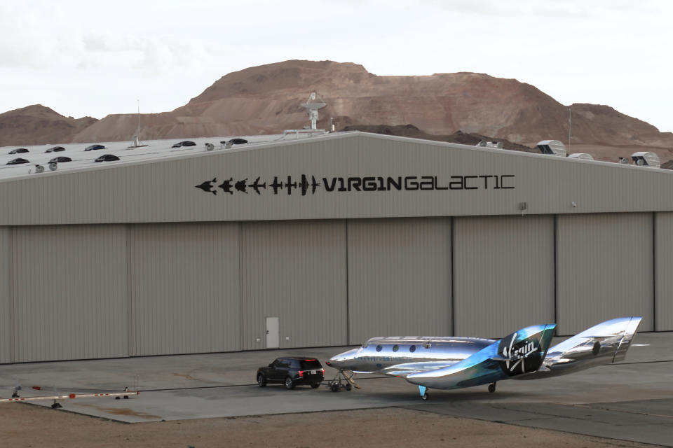 In this undated photo provided by Virgin Galactic is the VSS Imagine, the first SpaceShip III in the Virgin Galactic Fleet in Mojave, Calif. Virgin Galactic rolled out its newest spaceship Tuesday, March 30, 2021, as the company looks to resume test flights in the coming months at its headquarters in the New Mexico desert. Company officials said it will likely be summer before the ship undergoes glide flight testing at Spaceport America in southern New Mexico. (Virgin Galactic via AP)