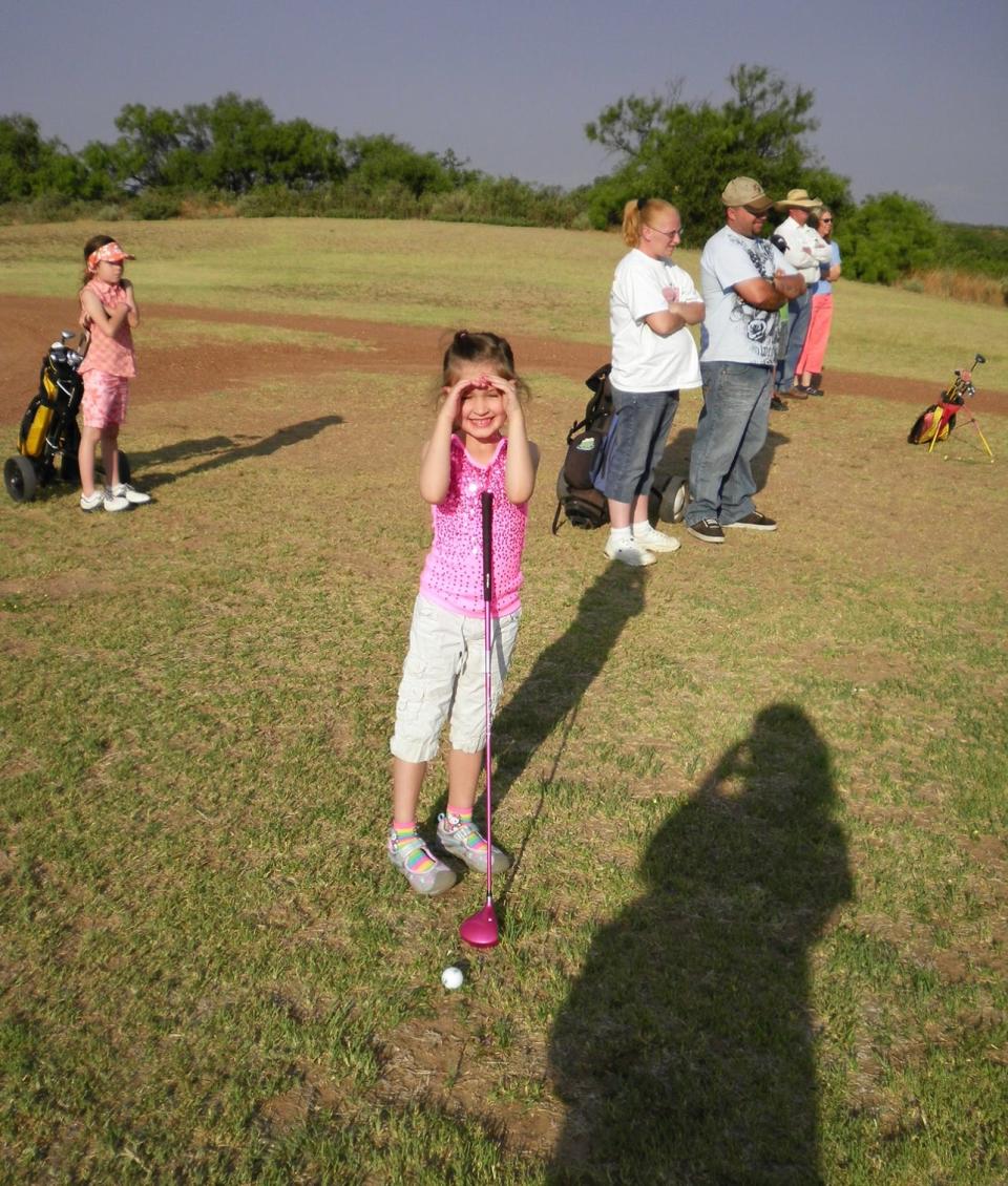 Maggie Cook started golfing when she was in kindergarten, as shown here.