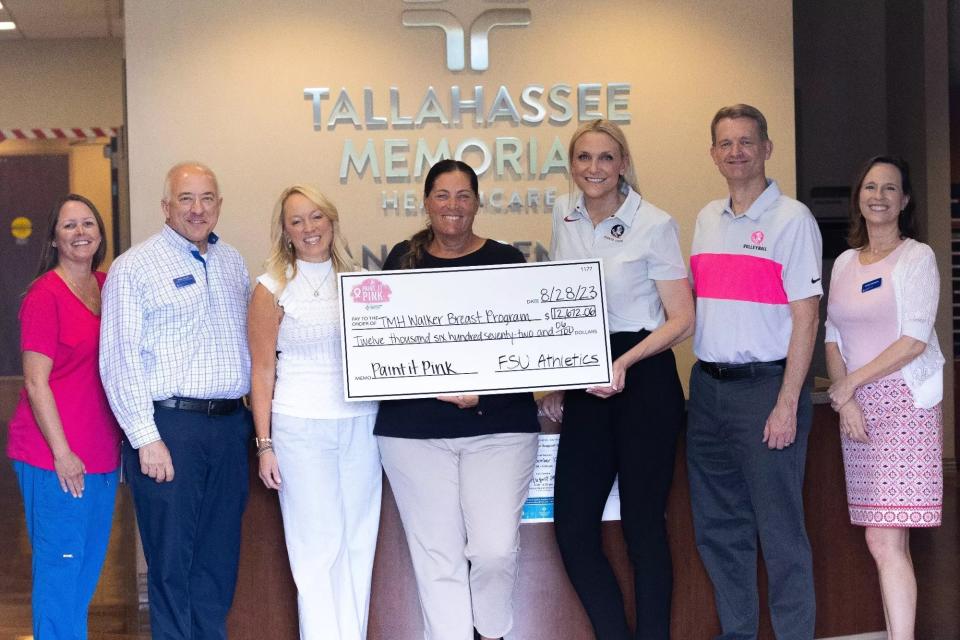 Florida State women's basketball head coach Brooke Wyckoff, softball head coach Lonni Alameda and volleyball head coach Chris Poole presented a $12,672 donation to Tallahassee Memorial HealthCare's Walker Breast Program on Aug. 28, 2023.