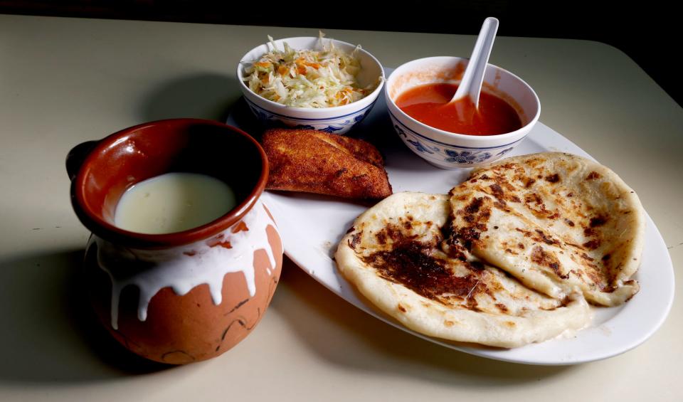 One of many Salvadoran dishes served at La Cuscatleca Inc. in Detroit is a fried corn tamale, pupusas, curtido, and a hot corn drink called Atol de Elote on Feb. 24, 2022.