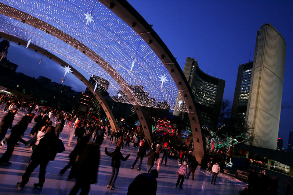 NEW YEAR’S EVE.12.31.2007.Skaters take to the ice at Nathan Phillips Square early Monday evening, De